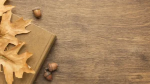 Top view autumn leaves with book copy space