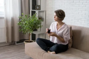 Girl is sitting couch with cup tea girl is resting home